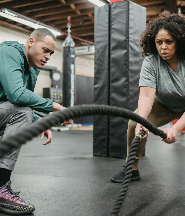 Man performing a functional strength exercise with determination.