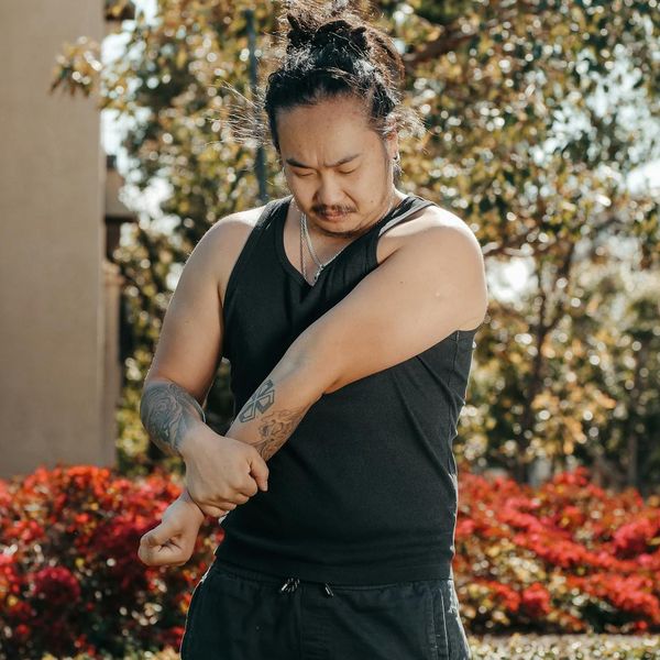 Man stretching outdoors feeling energized and positive.